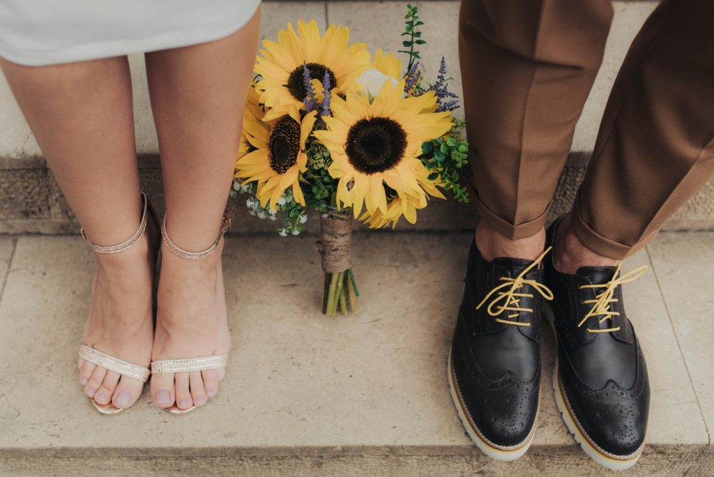 sunflowers between man and woman on staircase