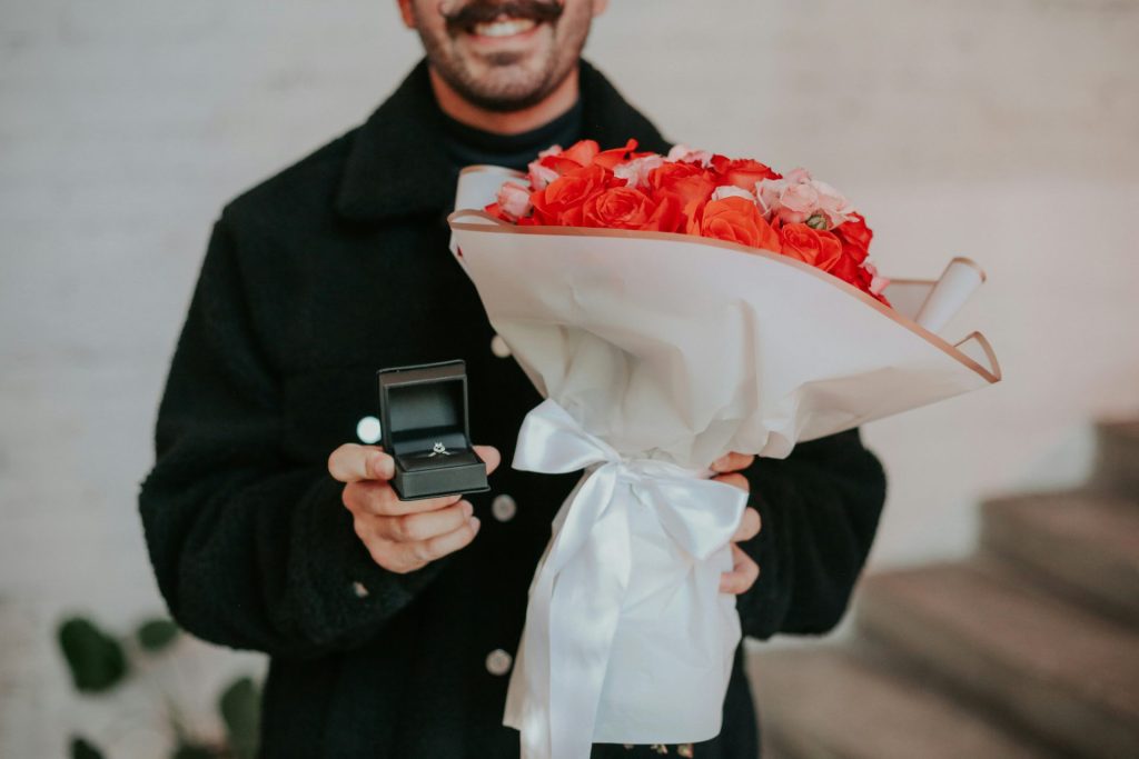a person holding a bouquet of flowers