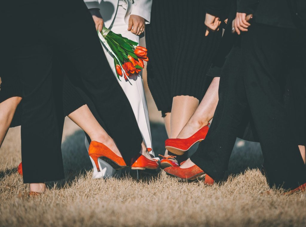 people wearing red pumps